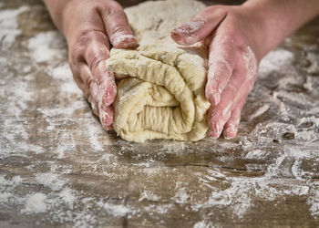 Midsection of person preparing food on table