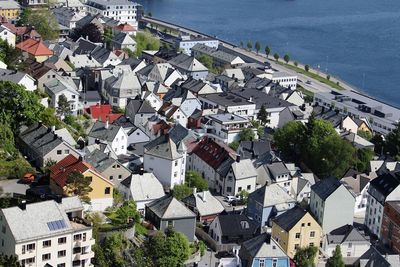 High angle view of townscape by sea