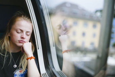 Woman sleeping in train