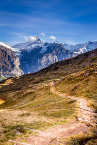 Scenic view of snowcapped mountains against sky