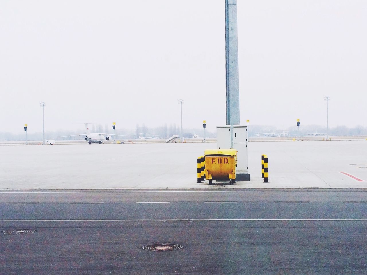 transportation, mode of transport, clear sky, copy space, road, land vehicle, car, street, yellow, on the move, outdoors, travel, pole, day, nautical vessel, street light, no people, guidance, journey, road marking