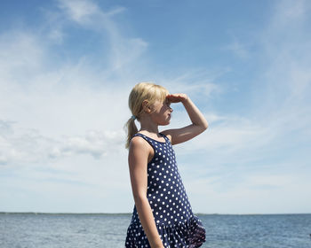 Girl gazing at ocean