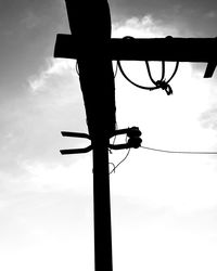 Low angle view of silhouette pole against sky during sunset