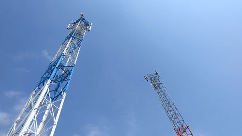 Low angle view of crane against sky