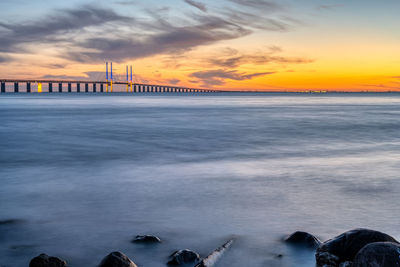 The oresund between denmark and sweden with the famous brigde after sunset