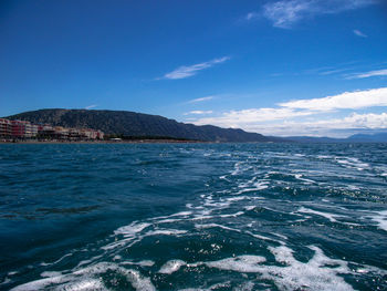 Scenic view of sea against blue sky