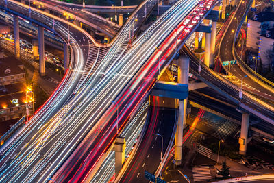 High angle view of light trails on road at night
