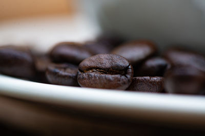 Close-up of coffee beans on table