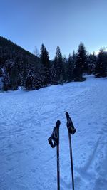 Scenic view of snow covered field against sky