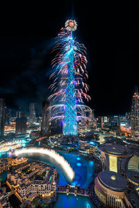 Illuminated city buildings at night