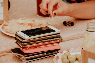 Man using mobile phone on table