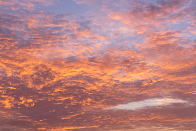 Low angle view of dramatic sky during sunset