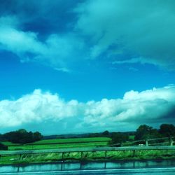 Scenic view of lake against cloudy sky