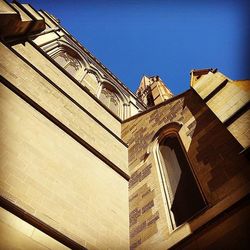 Low angle view of built structure against blue sky