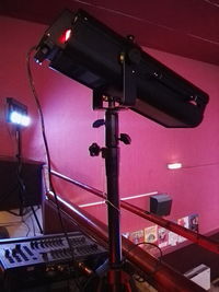 Low angle view of illuminated lighting equipment