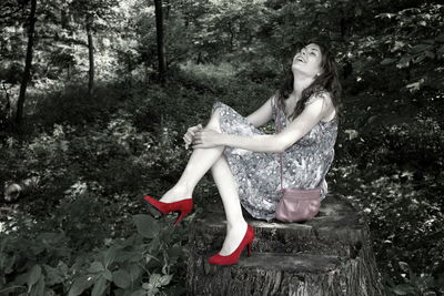 Woman sitting in a forest