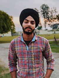 Portrait of young man standing outdoors