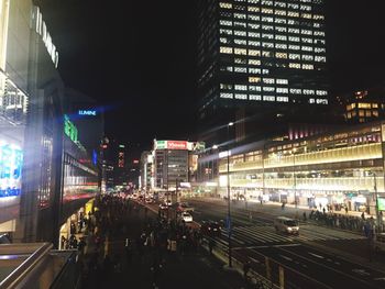 High angle view of illuminated city buildings at night