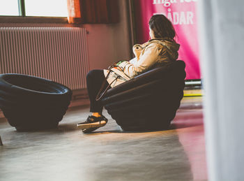 Woman sitting on floor