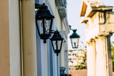 Low angle view of street light mounted on wall