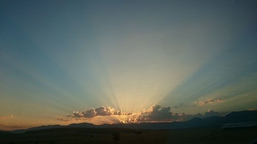 Scenic view of mountains against sky during sunset