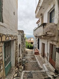 Empty alley amidst buildings in city