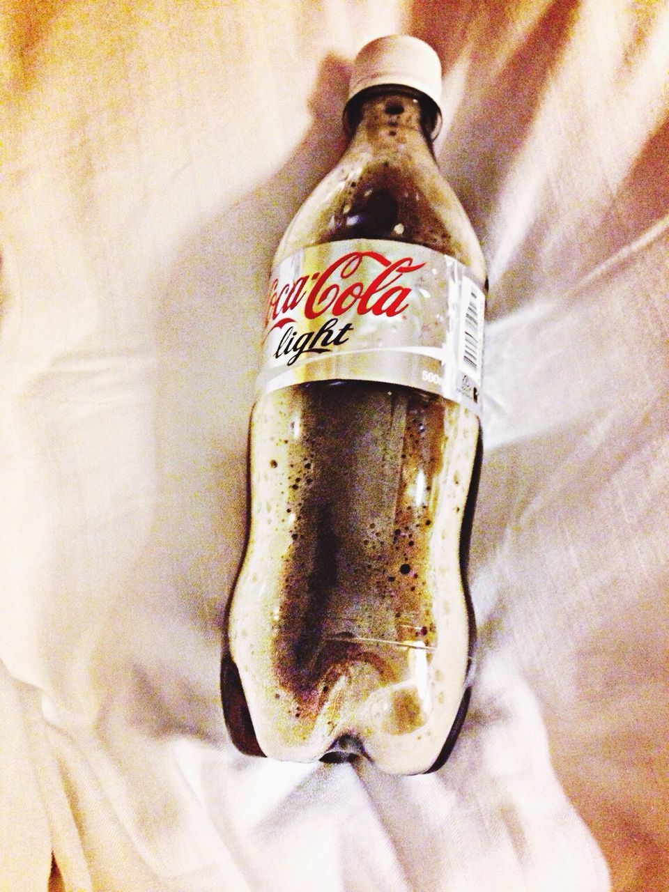 indoors, close-up, still life, food and drink, no people, high angle view, red, single object, wall - building feature, bottle, table, brown, metal, white color, day, home interior, old, wood - material, selective focus, text