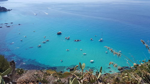 High angle view of sea against blue sky