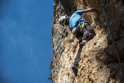 Low angle view of man on rock