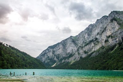 Scenic view of lake and mountains against sky