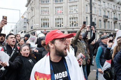 People standing on street in city