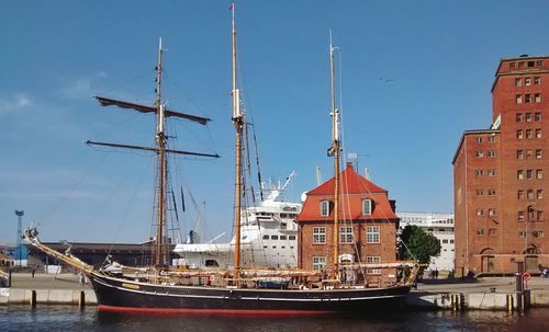 Moored boat against built structures