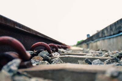 Close-up of railroad track against sky