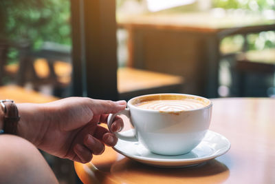 Coffee cup on table at cafe