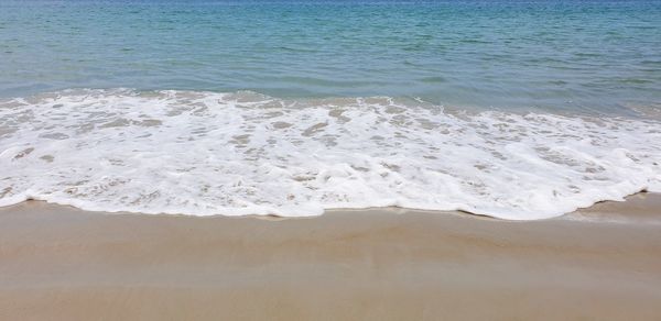 High angle view of surf on beach