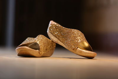 Close-up of shoes on table