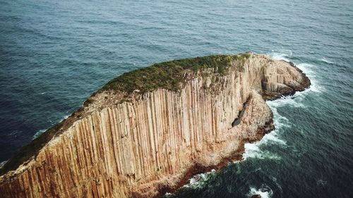 High angle view of rock in sea