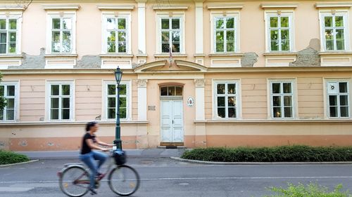 Woman riding bicycle in city