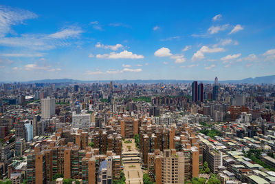 High angle view of modern buildings in city against sky