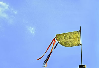 Low angle view of flag against sky