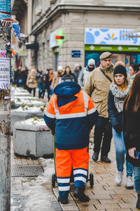 People on road in city