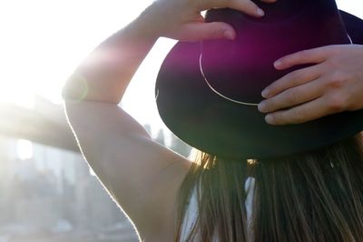 Midsection of woman holding umbrella