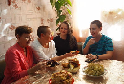 Group of people sitting on table