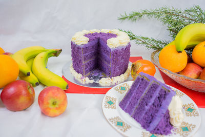 Close-up of cake and fruits on table during christmas