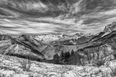 Scenic view of snowcapped mountains against sky