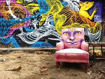 Portrait of woman relaxing on graffiti