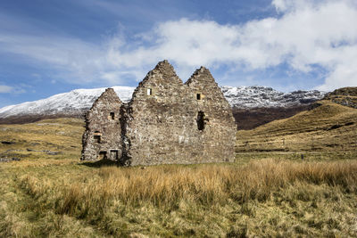 House on field against sky