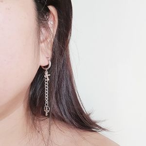 Close-up of woman wearing hat against white background
