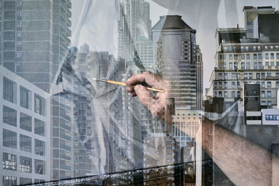 Digital composite image of man and modern buildings in city