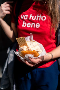 Midsection of woman holding food